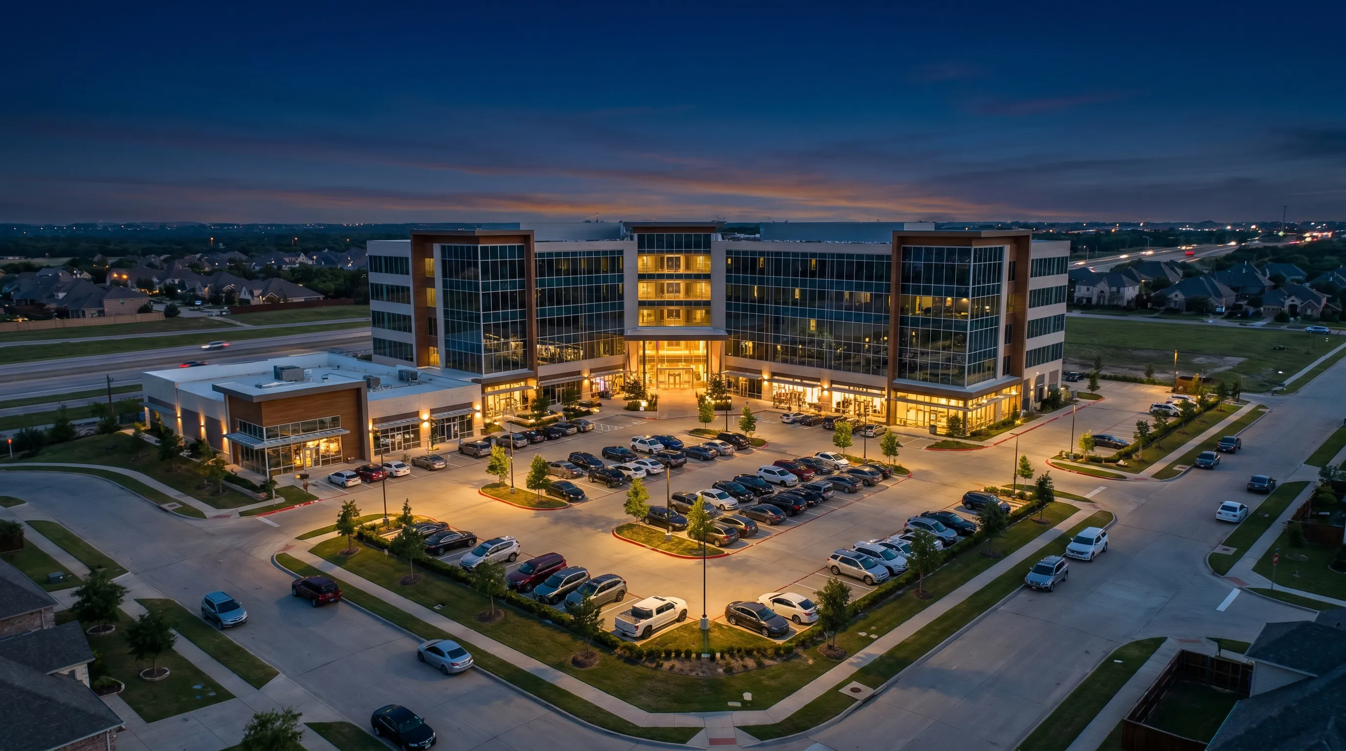 Commercial building at twilight, aerial.