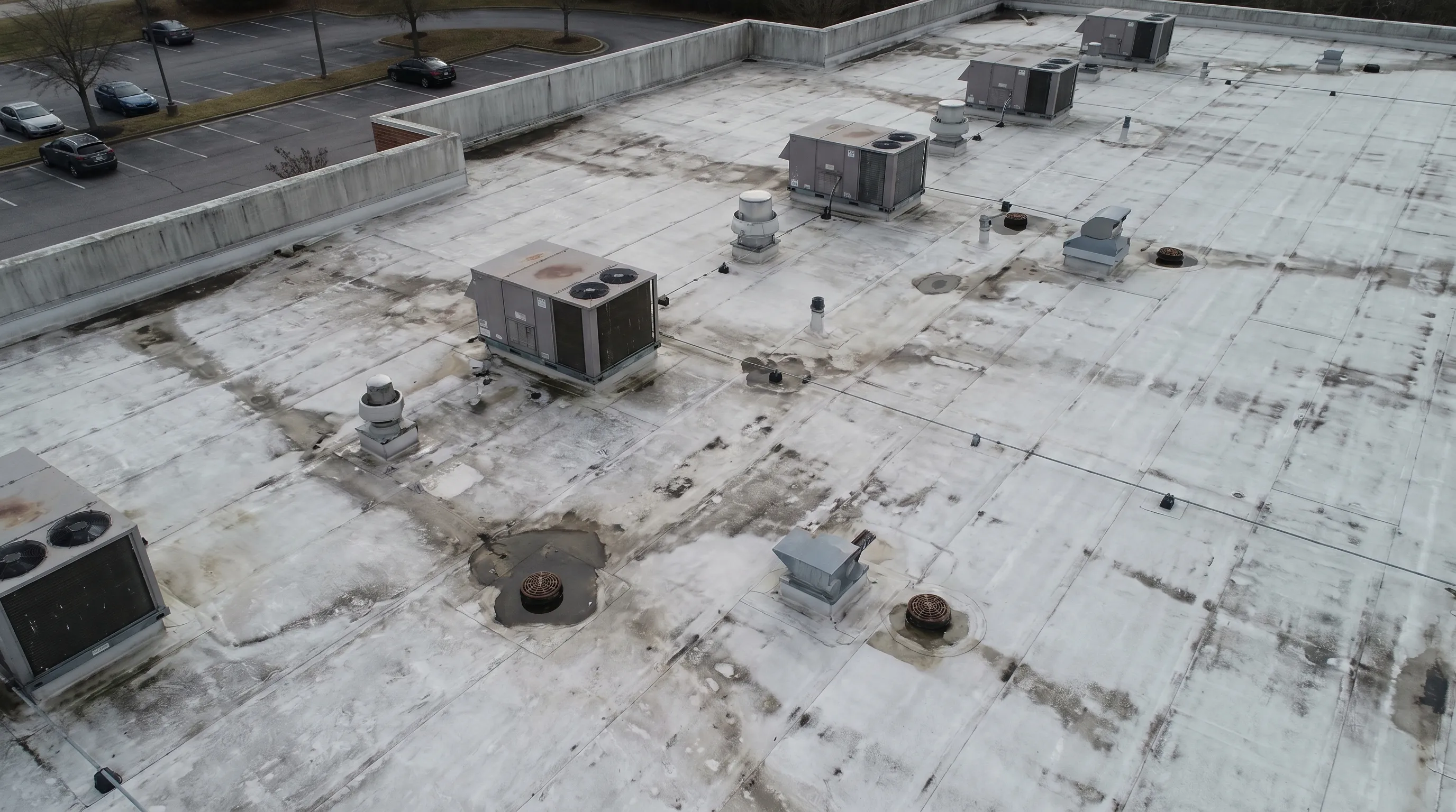 Drone inspection view of a commercial flat roof.
